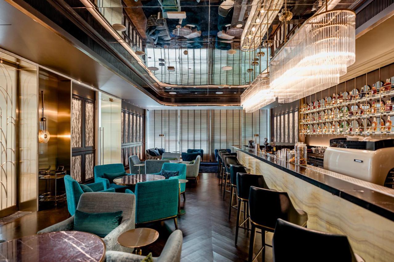 Silq Hotel & Residence Bangkok Exterior photo The bar at the 100 Queen's Gate